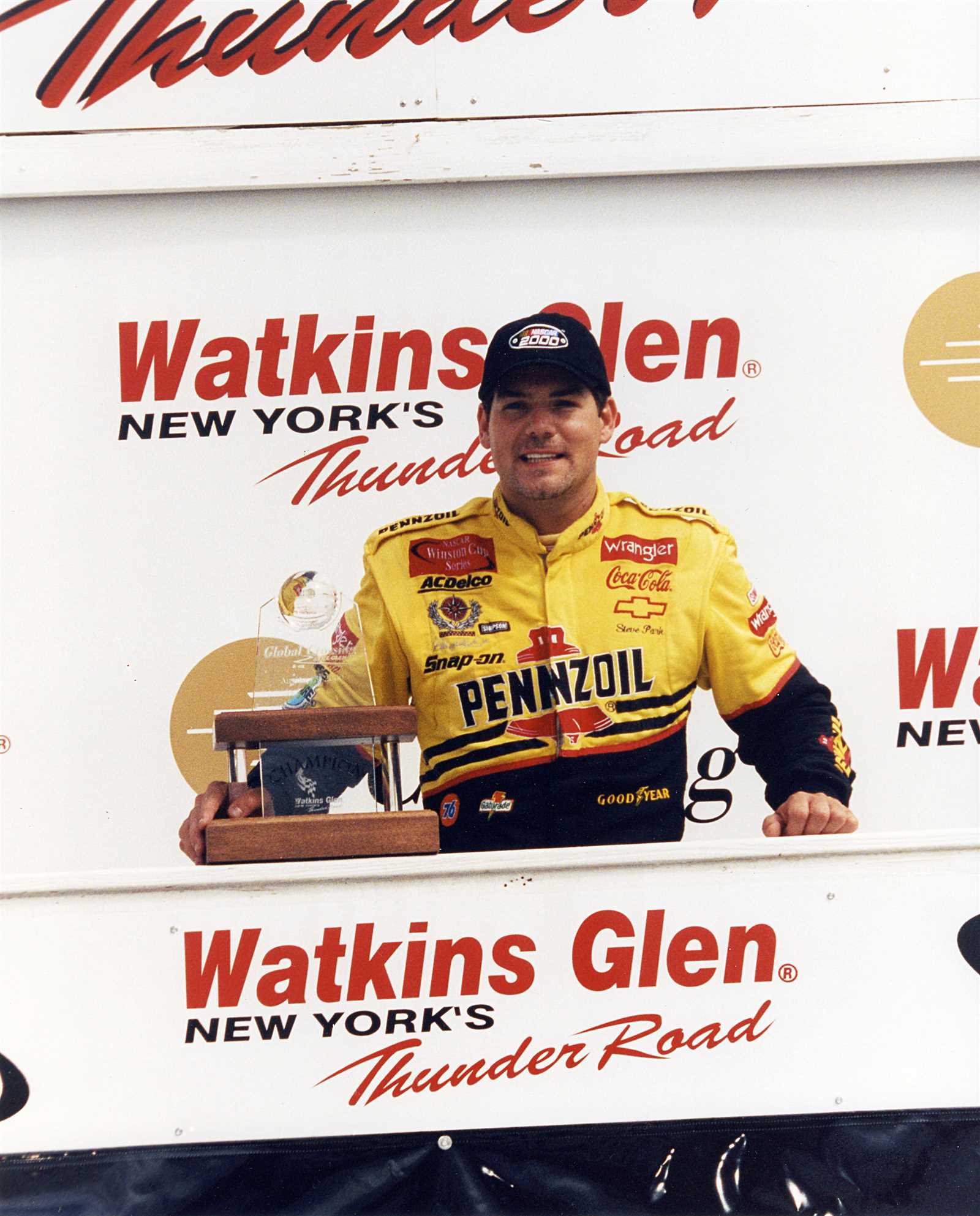 <p><u>Aug. 13, 2000</u><br />His boss, Dale Earnhardt, may have left him stranded at the track, but Steve Park was happy to find another way home. Park had just won the road course race after a 15.4-second pit stop for fuel and tires and successfully battling Mark Martin on the final lap. He was ready to celebrate his first Winston Cup win -- and did so on top of his car on the frontstretch. Park poses here in Victory Lane.</p>