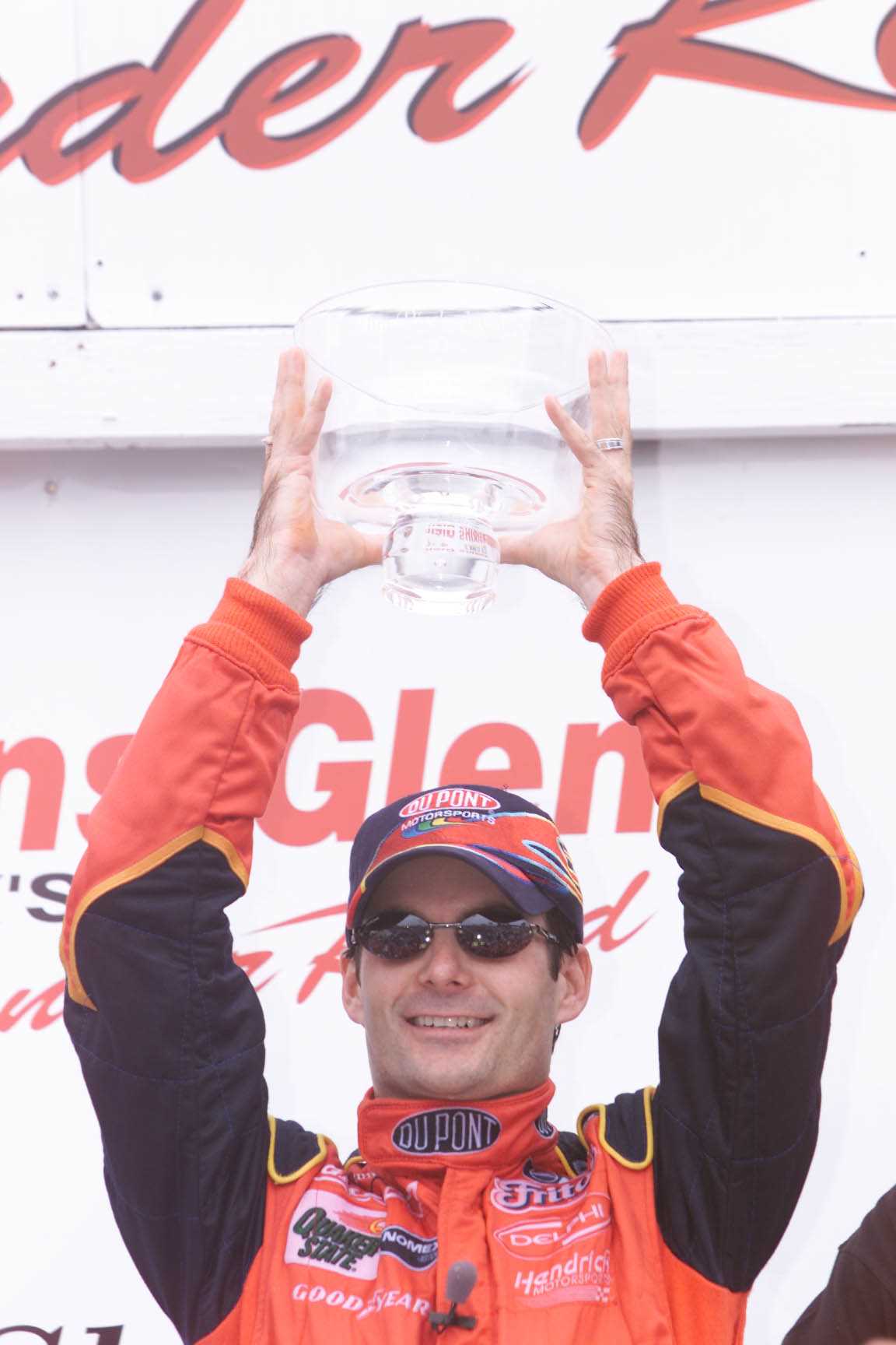 <p><u>Aug. 12 2001</u><br />Back when it was cool to hate Jeff Gordon, NASCAR fans set a 'Honk if you hate Gordon' sign on the way to the upstate New York road course, according to a New York Times story on the race. The driver responded with a victory, finishing 0.172 seconds ahead of Jeff Burton. The Hendrick driver's record-setting fourth win at the track is a feat that has only been matched by Tony Stewart. Gordon went on to win the championship that year.</p>